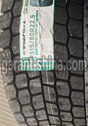 Windforce Trans Master GDL390 (приводная) 315/80 R22.5 160/157K 22PR - Фото протектора с этикеткой вблизи